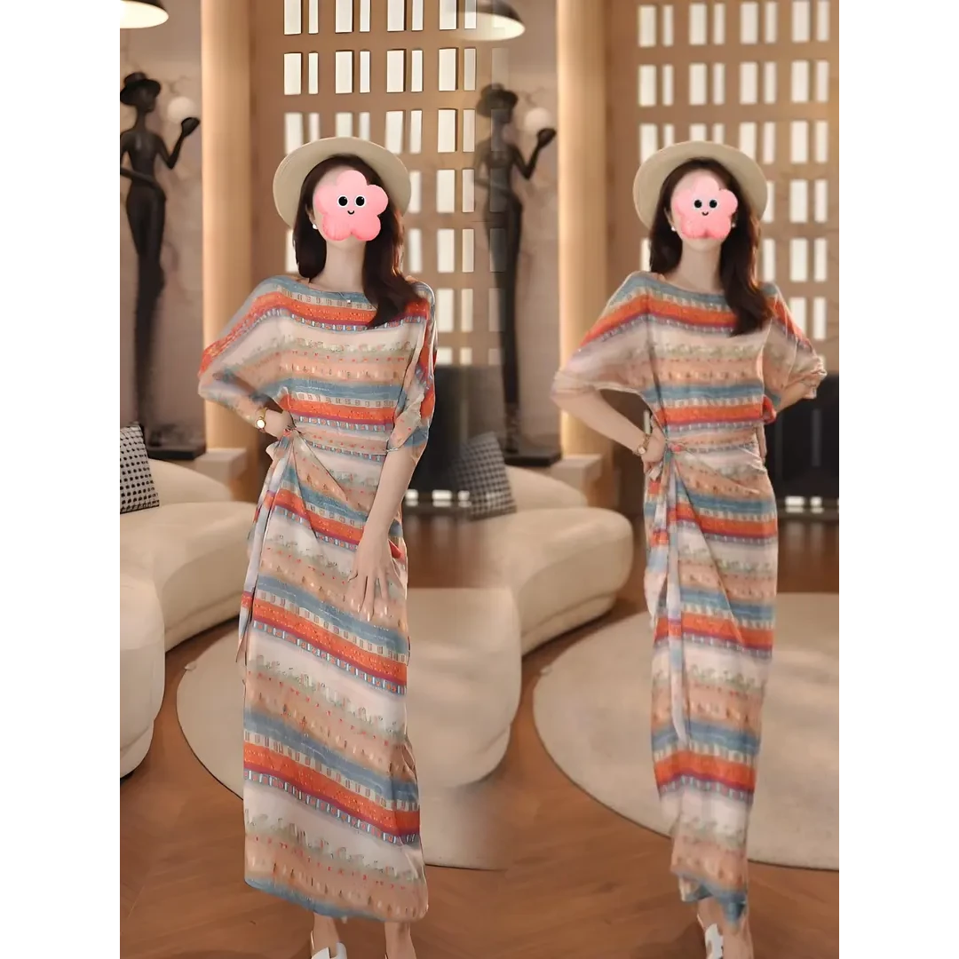 E242法式设计感镂空一片式围裹碎花连衣裙女2025夏季气质圆领长裙