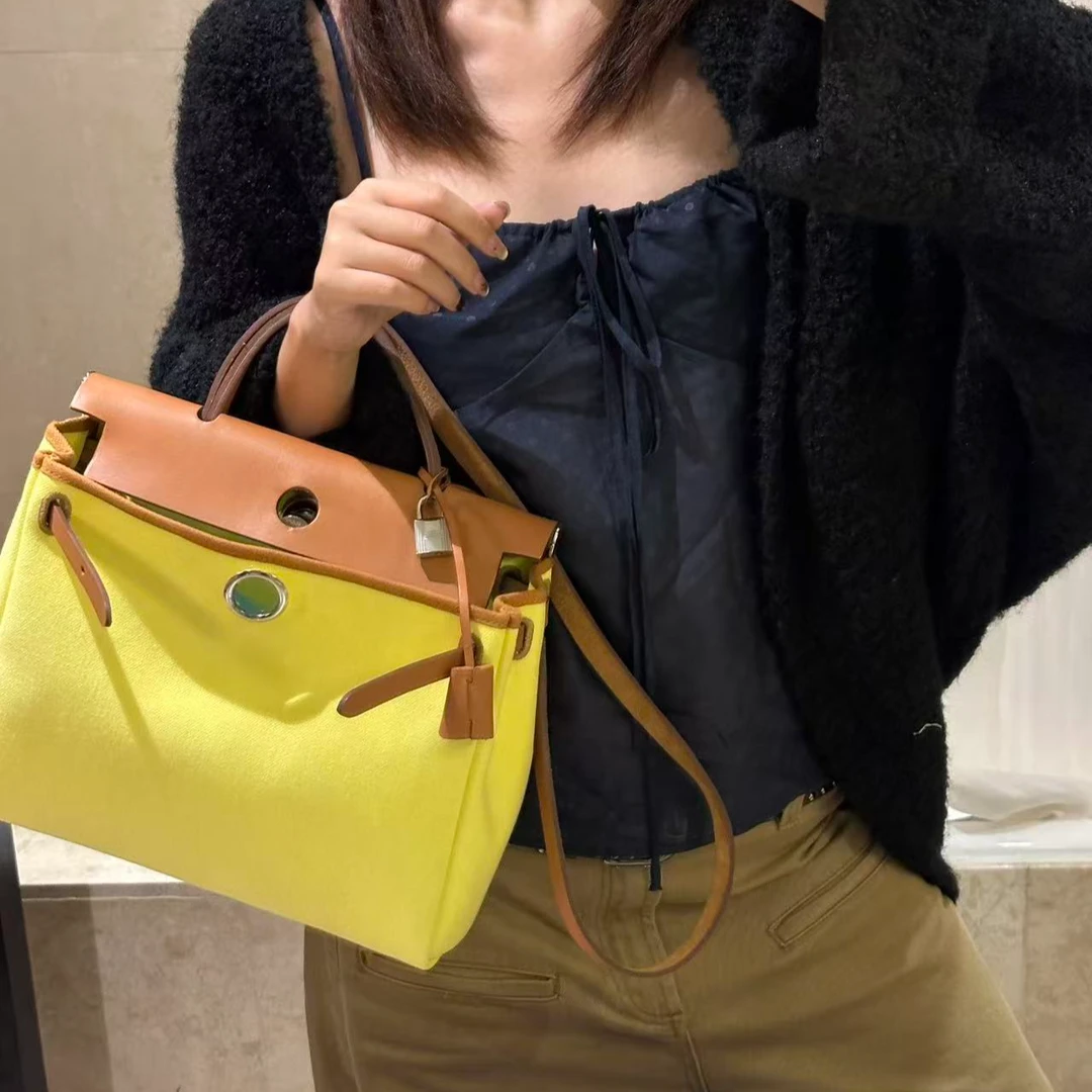 95新 Hermes/爱马仕 展会外场！柠檬黄拼棕色herbag31