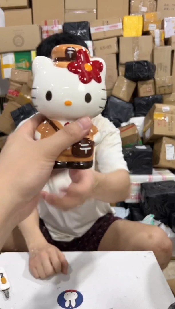 瓷片棕色kt猫邮递员存钱罐