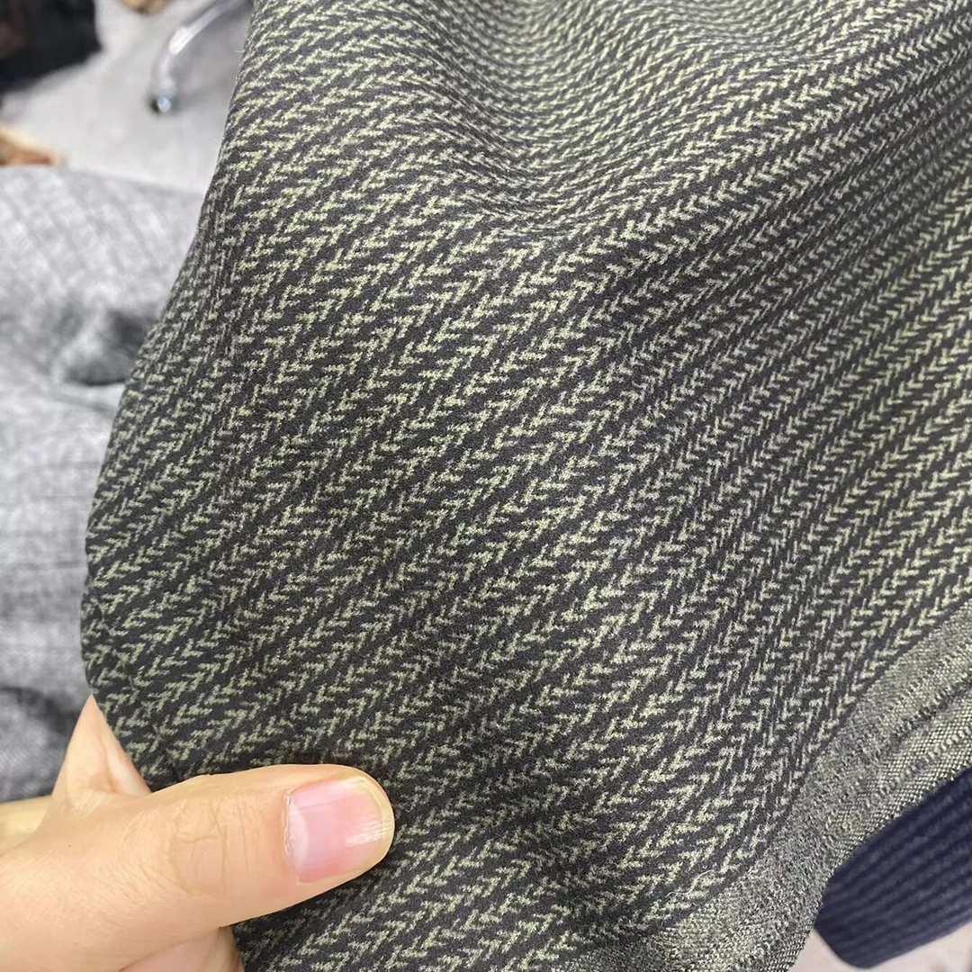 绿色人字麦穗纹针织面料高品质罗马小羊绒舒服有弹力