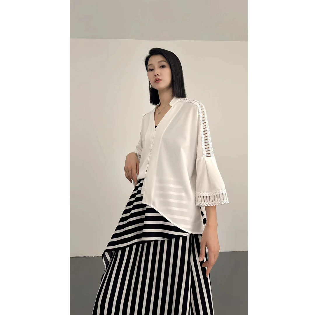 鑫鑫2025秋季新款法式轻奢慵懒高级感不规则长袖镂空设计衬衫1627