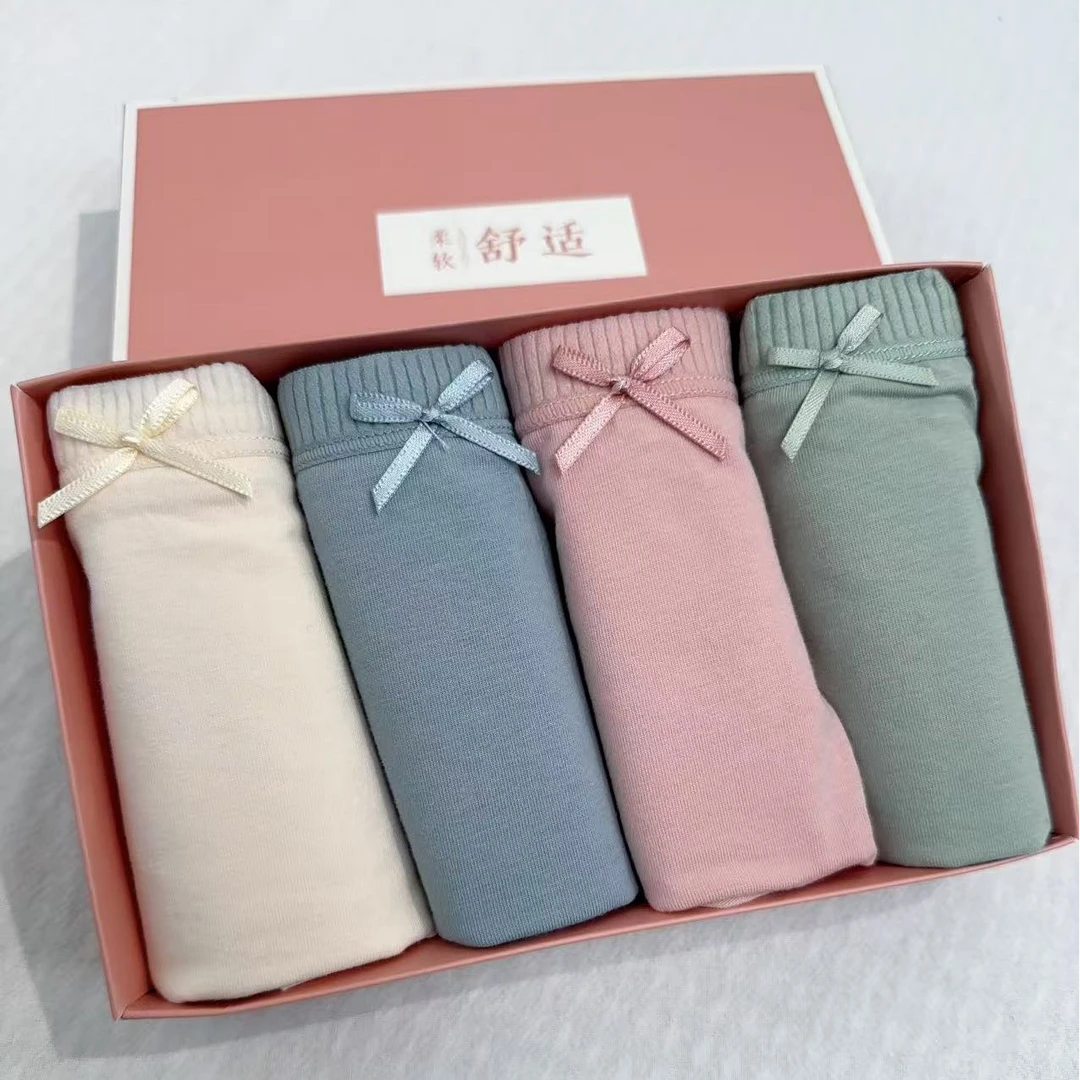 338女士棉氨蝴蝶结三角裤透气休闲风一盒四条装