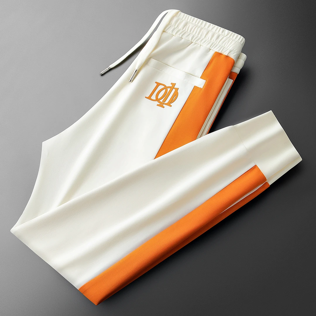 罗尔基那斯夏季潮流撞色拼接冰丝空气层男士修身运动卫裤休闲裤