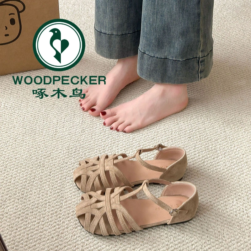 啄木鸟平底编织镂空罗马凉鞋女2025年夏季新款复古包跟包头凉鞋女