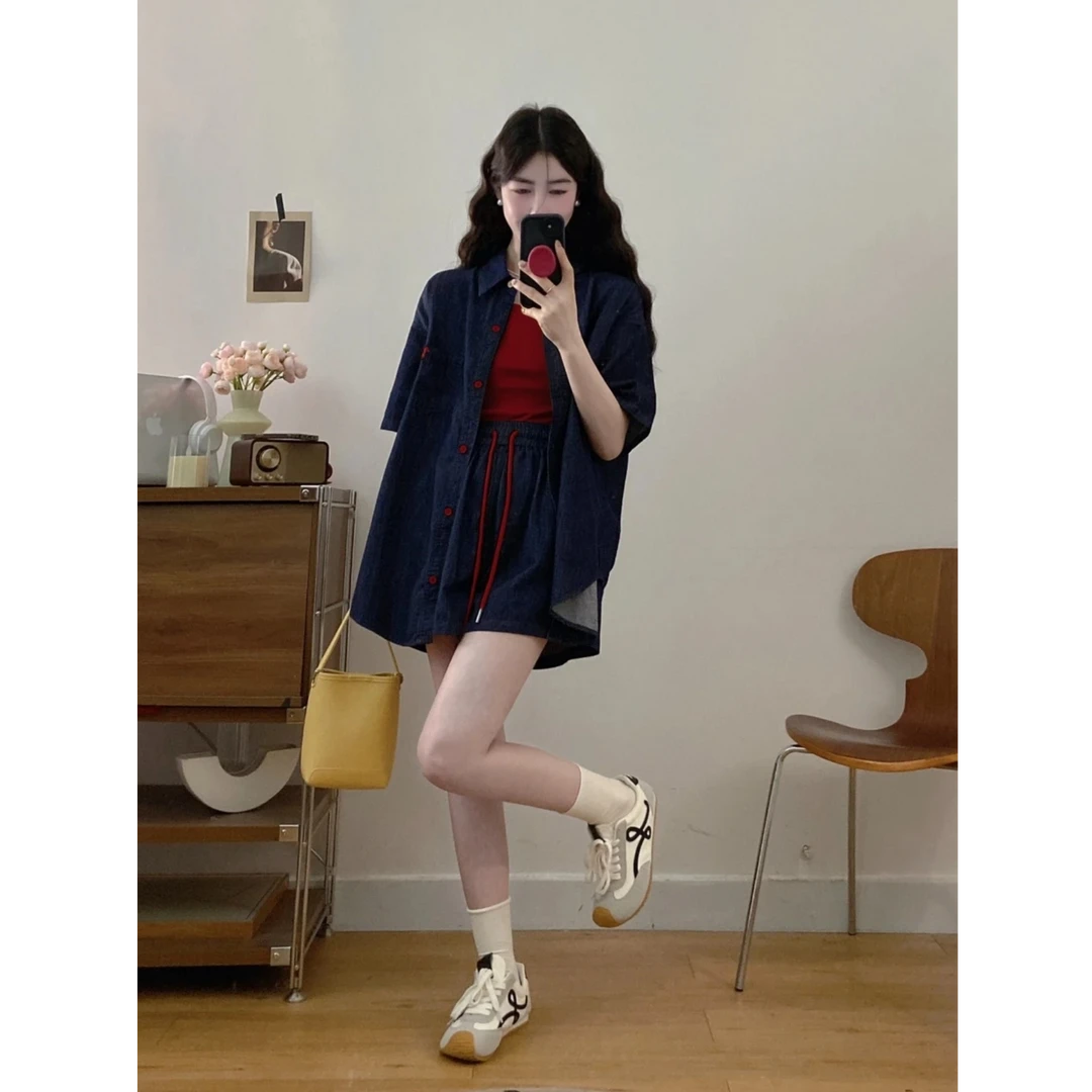 休闲深蓝色牛仔套装女夏2025新款韩版短袖衬衫高腰骑行两件套