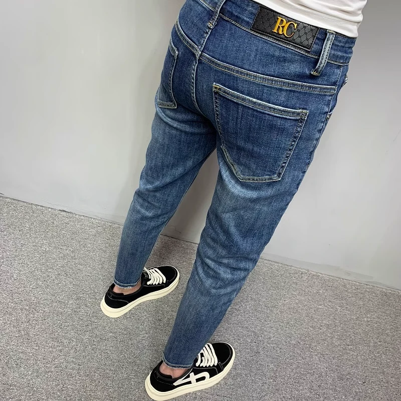 韩版潮流2025春夏新款牛仔裤男水洗蓝色修身小脚弹力百搭九分长裤