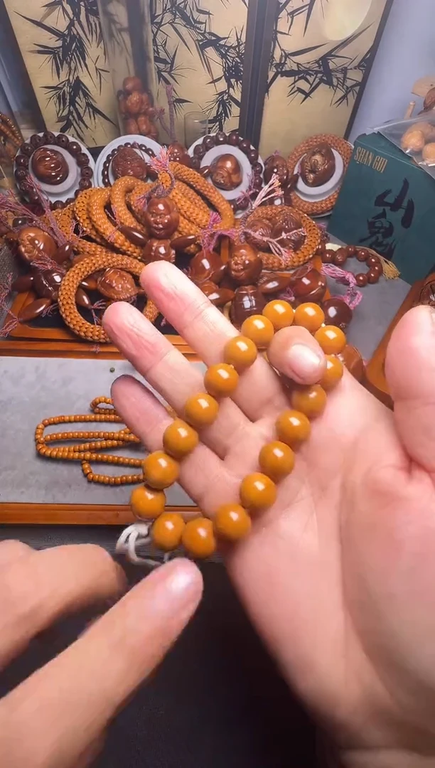 手串橄榄核小***~猴头光珠