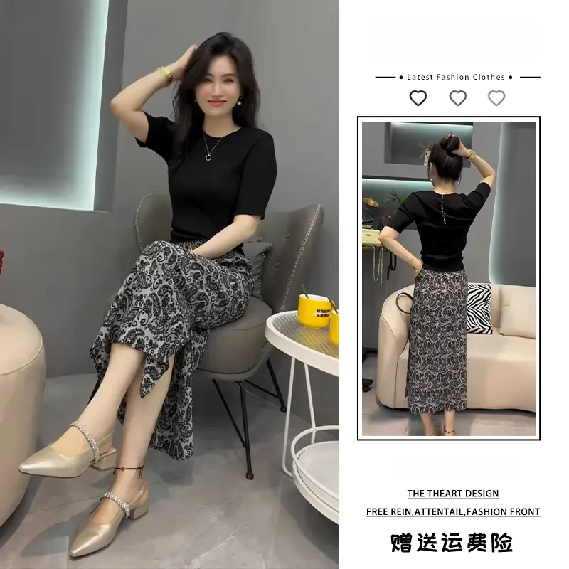 五一出游出片穿搭黑色针织上衣小众设计豹纹碎花半身裙盐系两件套