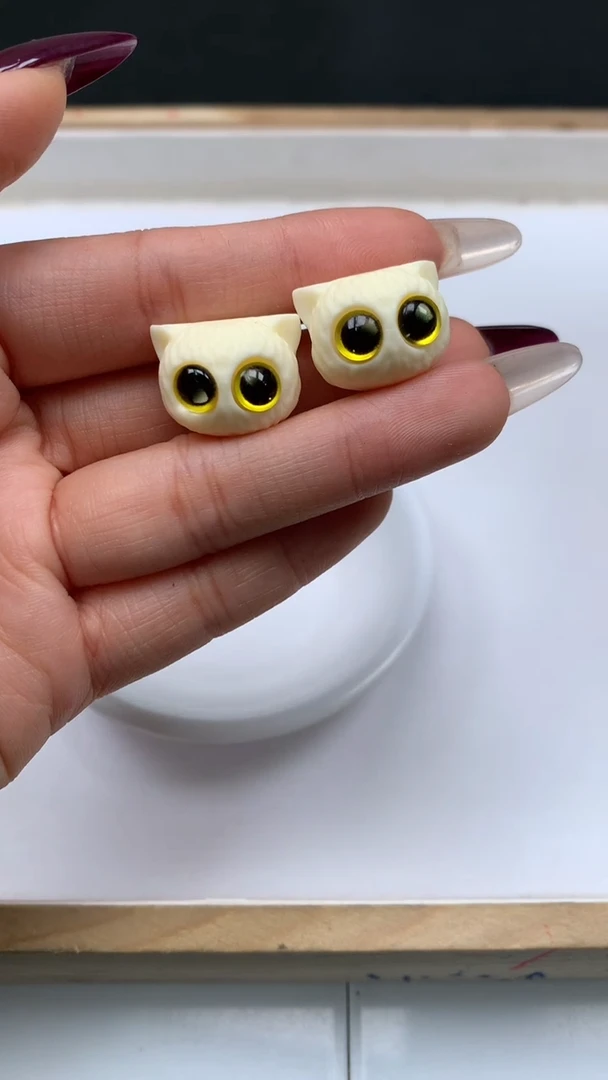 菩提散珠E882 牙 牙 果 黄眼猫头18*14mm 1个5元