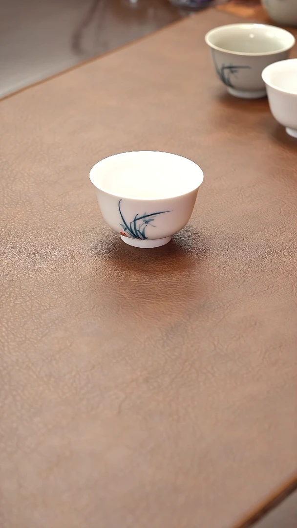 瓷片柴烧白瓷压手杯-兰花