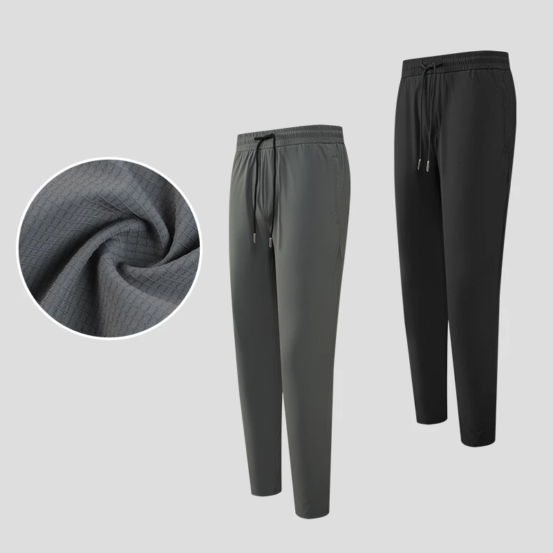 夏季弹力冰丝裤休闲男士户外跑步拉链口袋小脚裤93100（无运费险）