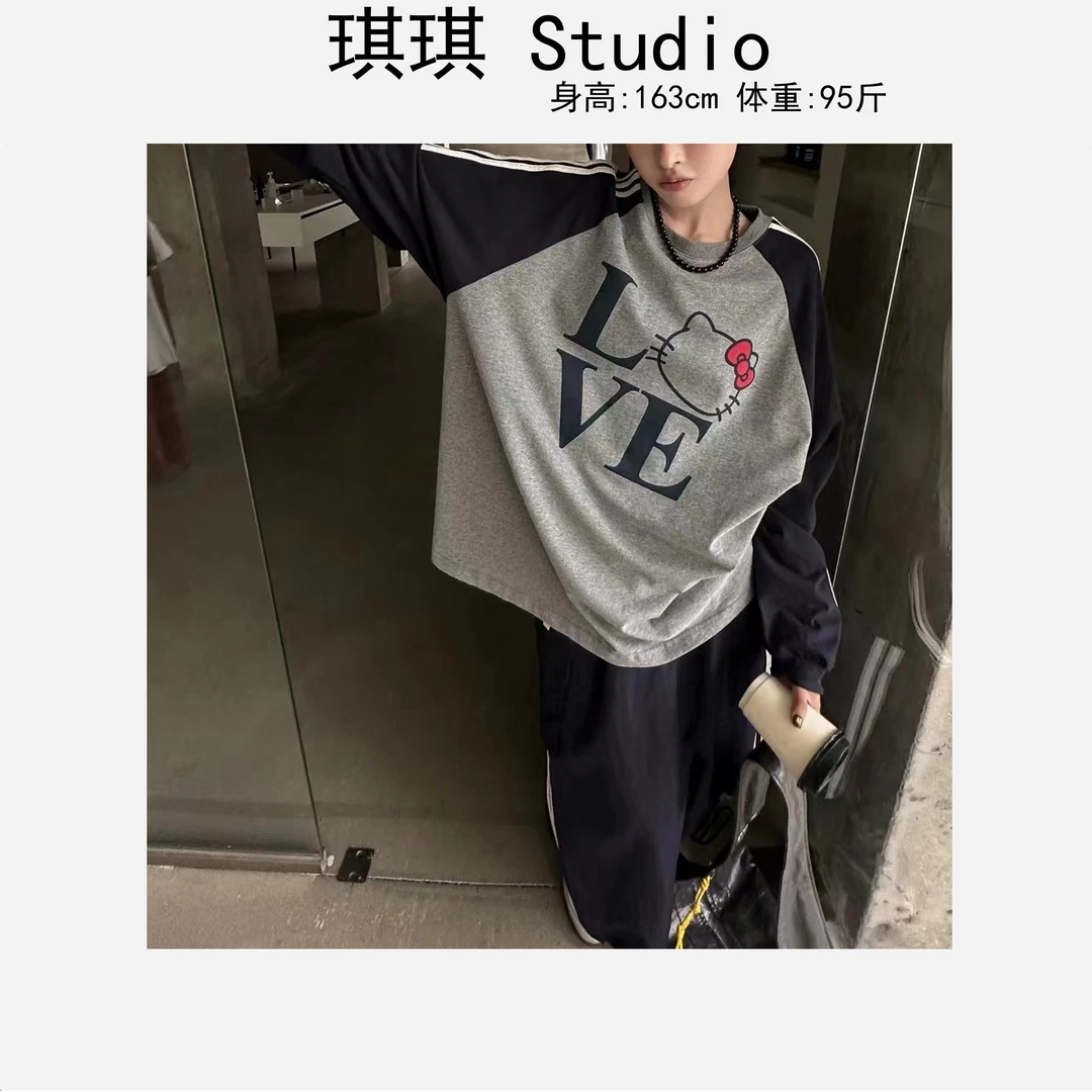 早春新款气质时尚圆领拼色袖杠字母猫咪气质减龄显瘦上衣702-G