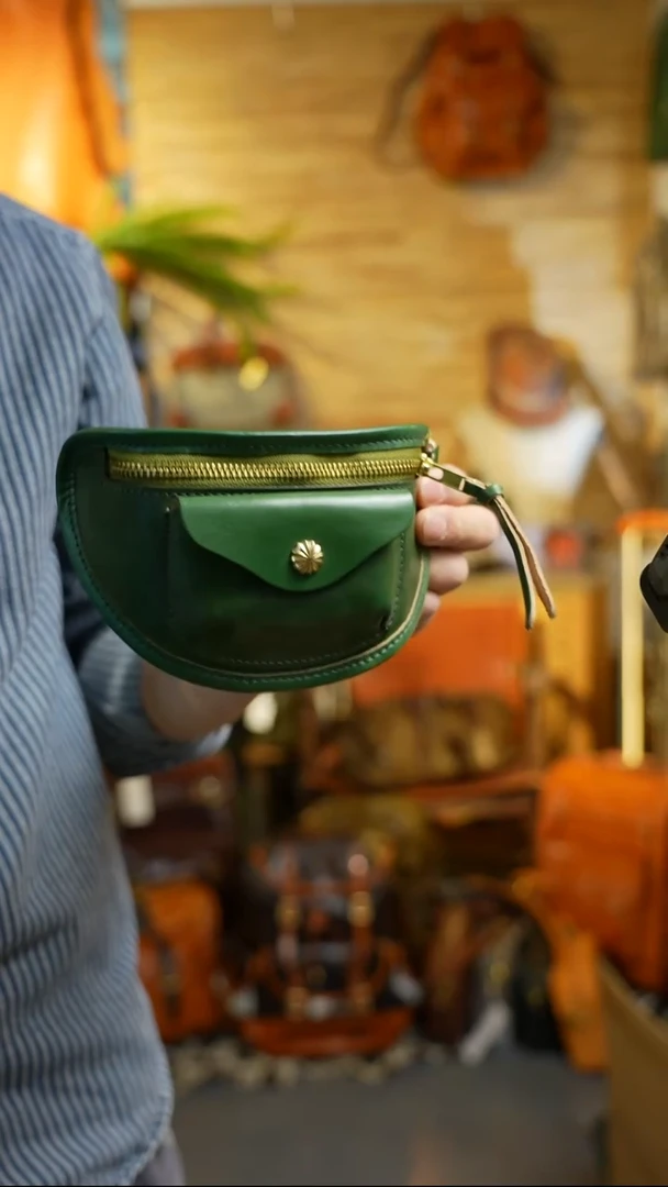 041墨绿色贝壳包