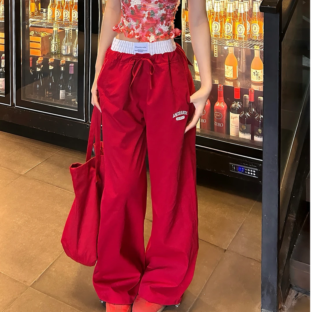 美式拼接假两件刺绣休闲裤女2025新款设计感辣妹红色阔腿拖地裤子