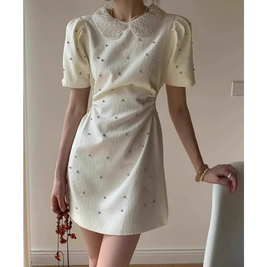 钉钻小香风连衣裙女修身气质设计感镂空心机露腰中长裙子