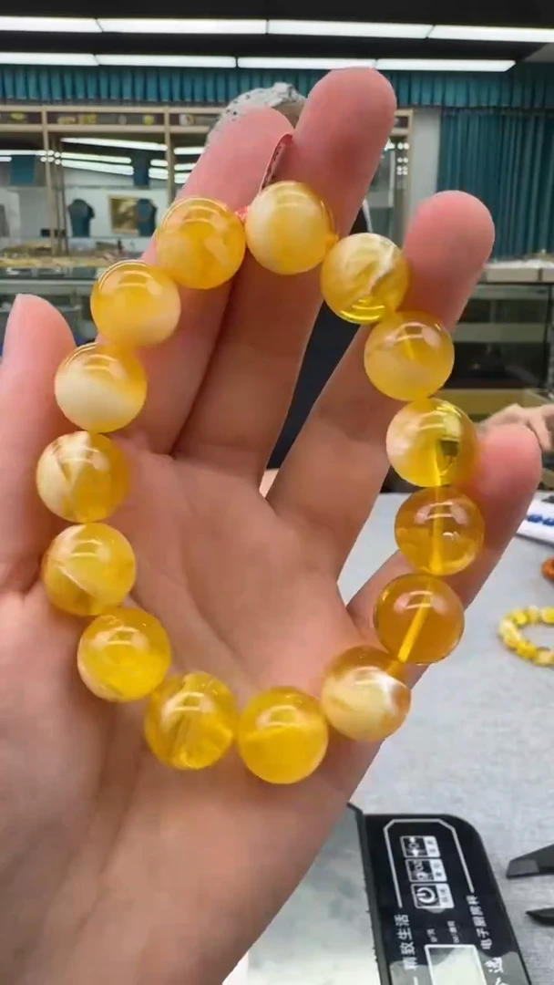 未镶嵌琥珀手链78秒拍号假一罚十