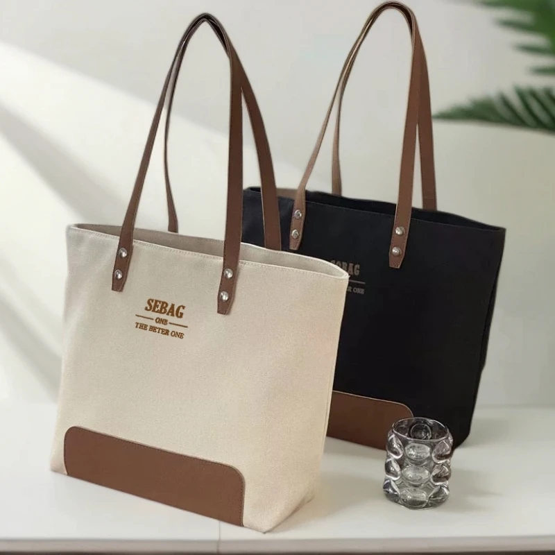 原创设计韩版简约高级通勤帆布托特文艺休闲百搭学生手提单肩包袋