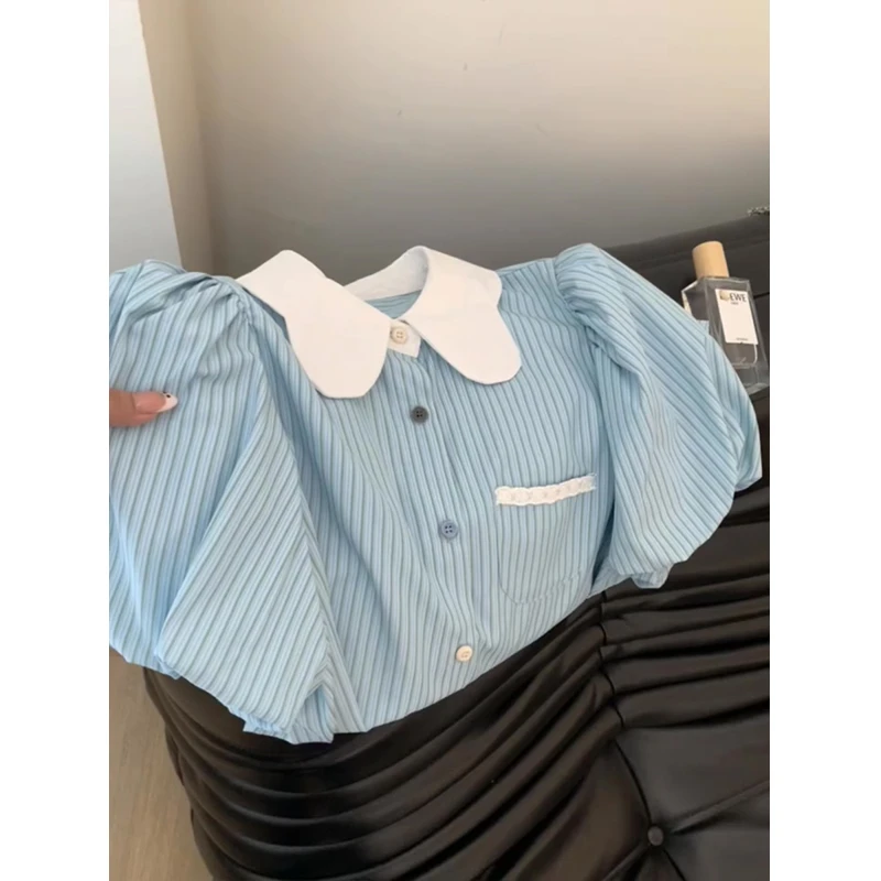 蓝色条纹撞色娃娃领衬衫女夏季2025新款设计感正肩泡泡袖衬衣上衣