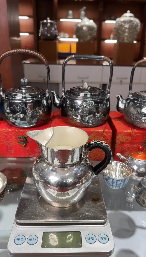 **足银999精工手工锤纹素面煮茶器