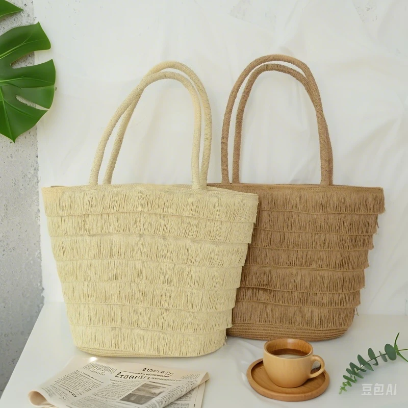 田园风手工草编手提包包女夏季2025新款法式海边流苏沙滩编织包
