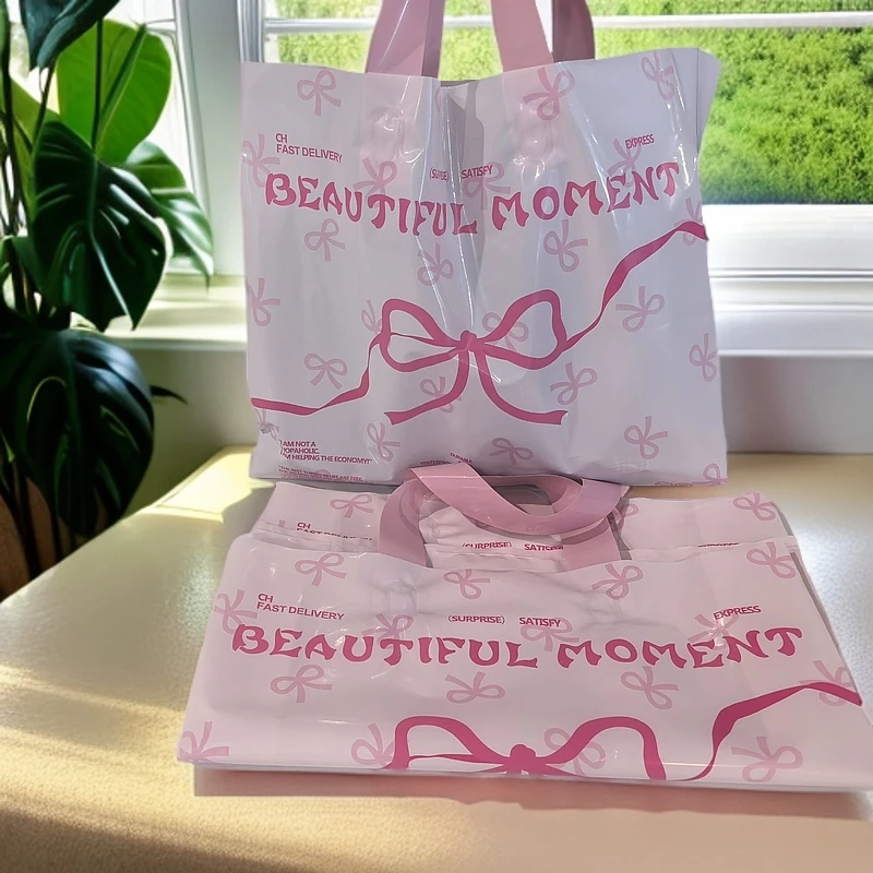 [新款]蝴蝶结塑料袋服装店手提袋礼品袋包装袋女装购物袋礼物袋