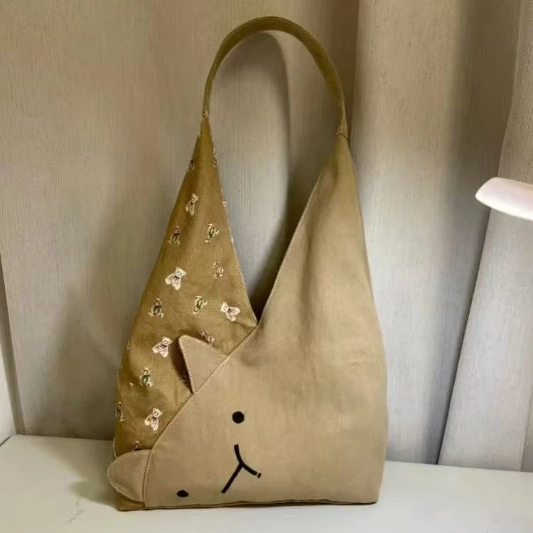 2025新款日系小众设计单肩包女可爱猫咪大容量水桶包休闲百搭包包