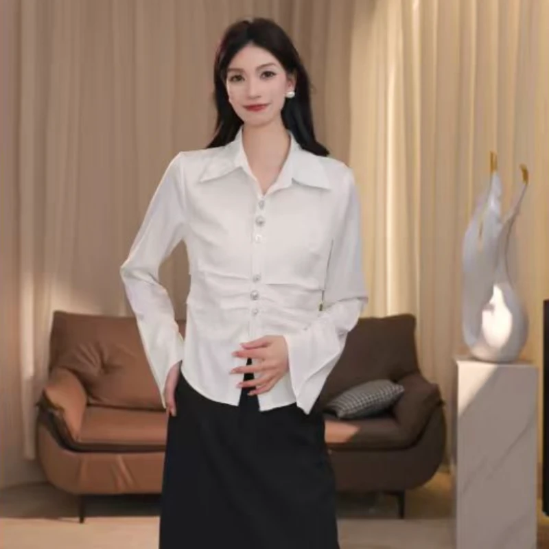 QH80633不规则收腰翻领长袖2025秋季高级感法式通勤衬衫