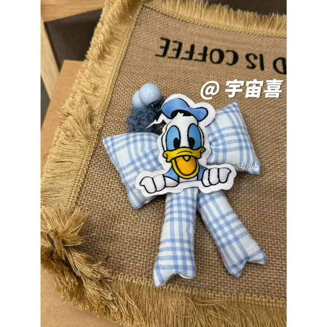 【蓝白枕头蝴蝶结唐老鸭毛绒发圈】