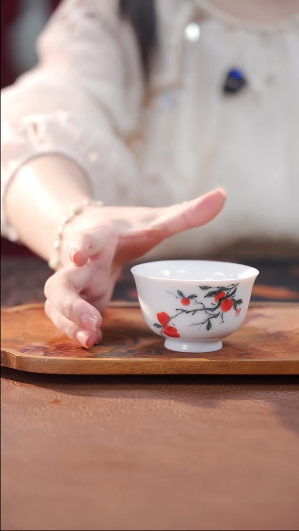 柴烧白瓷压手杯-柿子