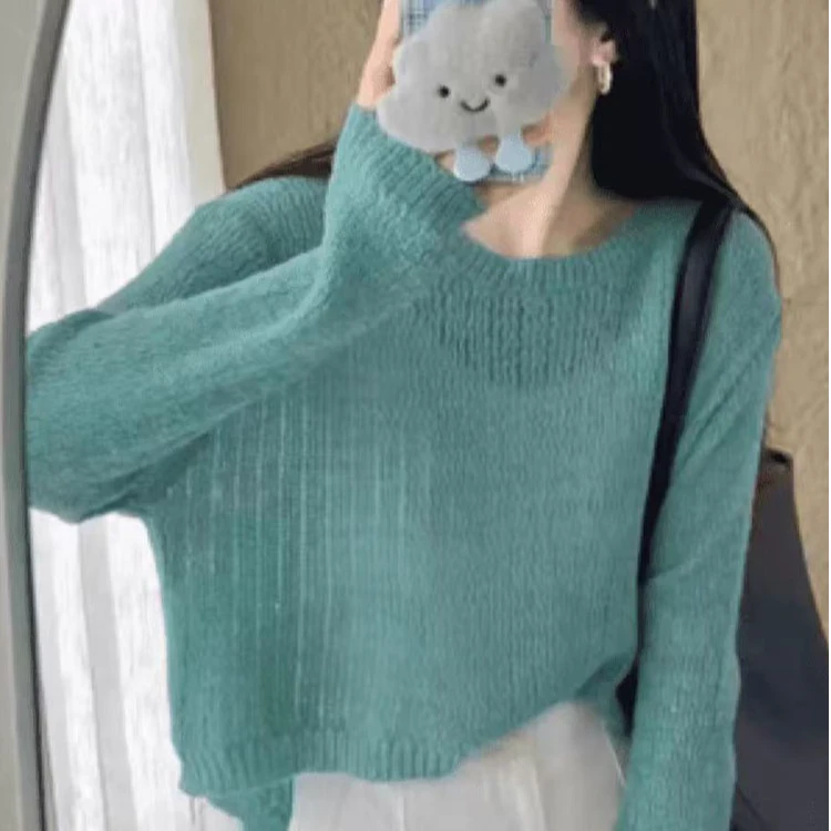 2025春装新款后背纽扣设计感针织罩衫女短款亮丝薄毛衣长袖镂空衫