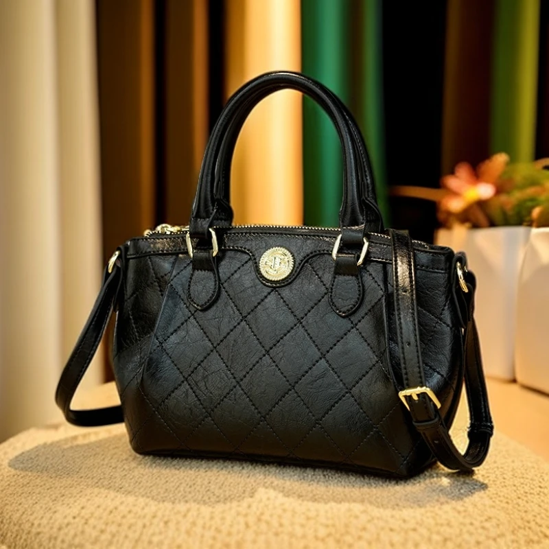 戈兰黛2025春季新款百搭轻奢饺子包黑色绣线气质单肩斜挎包包休闲