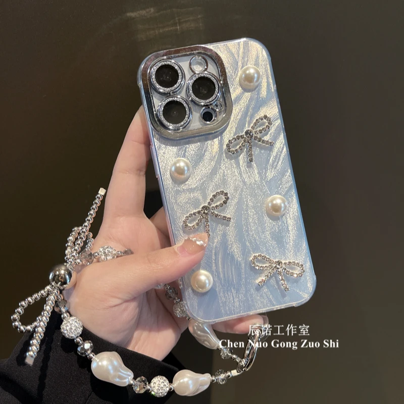 适用苹果华为荣耀oppo/vivo小米手机壳镜头膜珍珠小蝴蝶结手链女