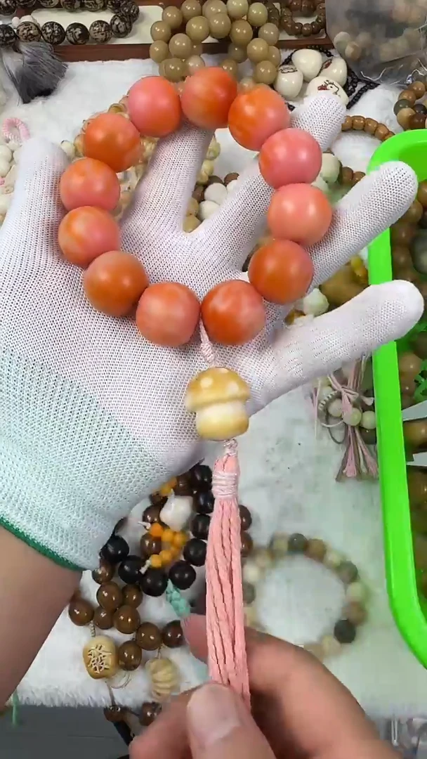 菩提根/象牙果手串23橘粉手持