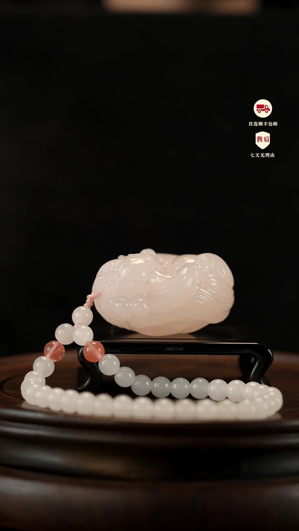 云南石樱花粉九尾狐手把件