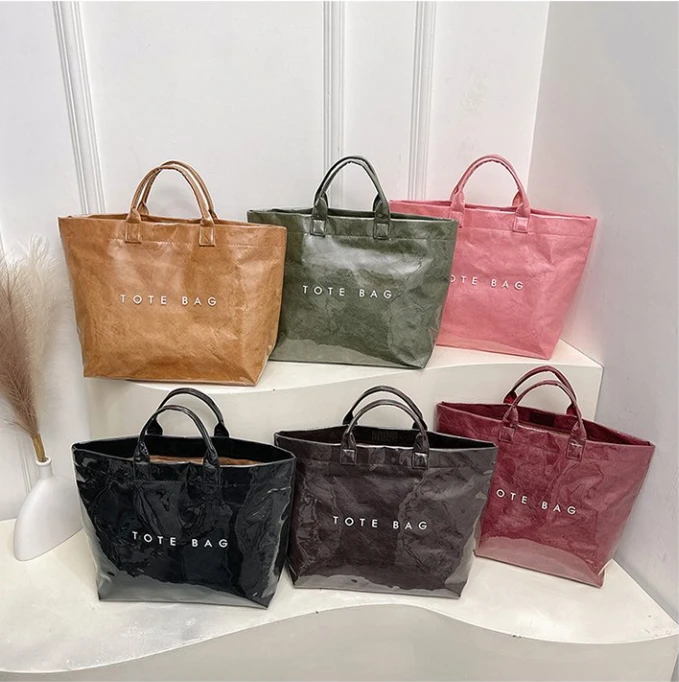 新款大容量杜邦纸手提透明防水果冻PVC上班通勤旅行包妈咪手提包