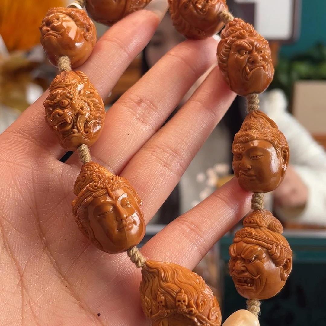 橄榄核核雕佛头的