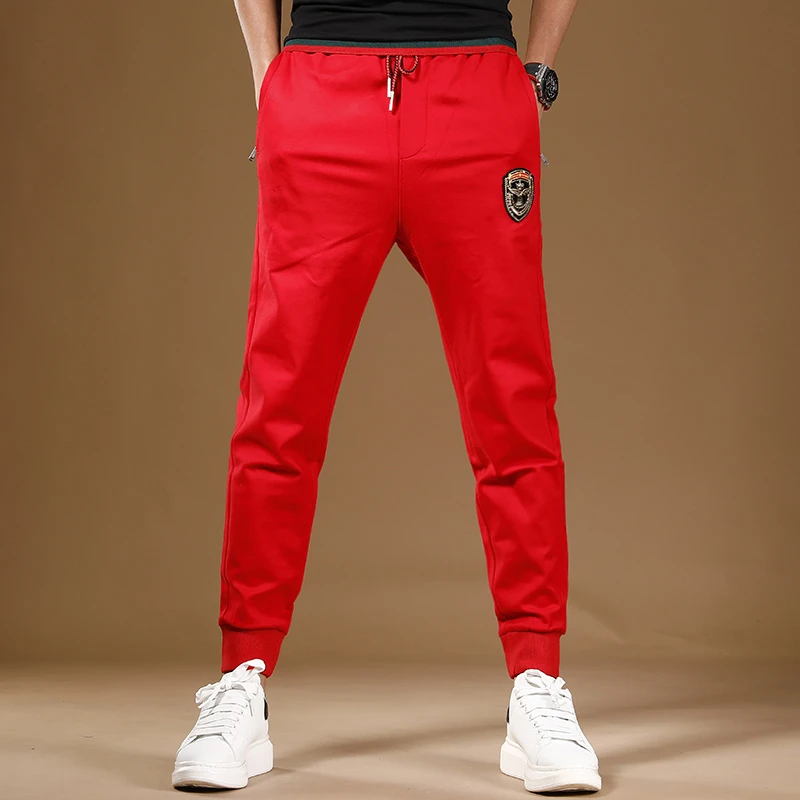 高档刺绣松紧腰百搭裤男红色裤子男长裤束脚运动裤针织卫裤男士