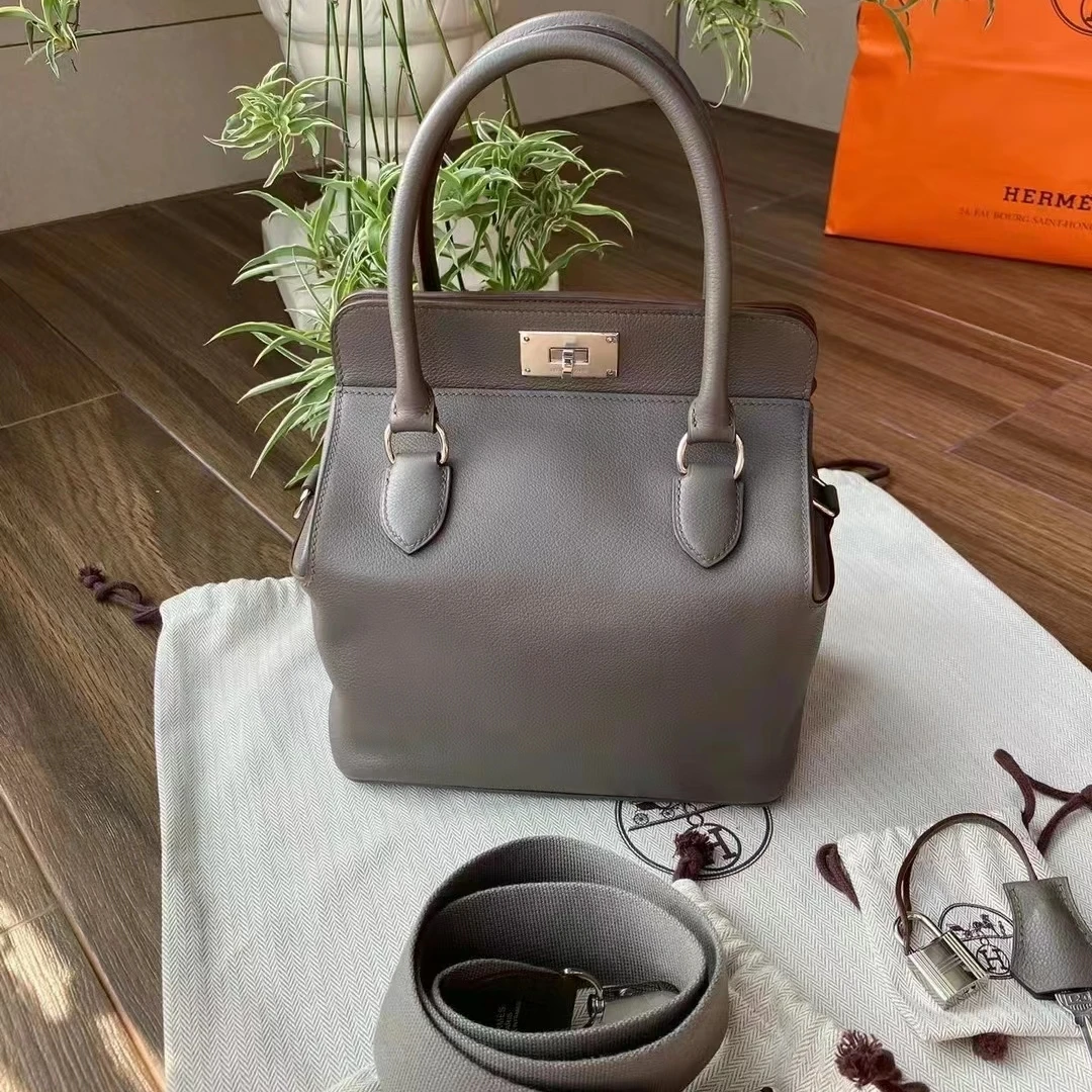 95新 Hermes/爱马仕 蔚蓝/锡器灰牛奶盒子26手提包 X刻