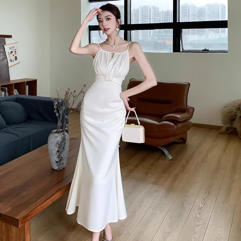 白色鱼尾包臀挂脖吊带连衣裙女夏季收腰气质超仙名媛高级感长裙子