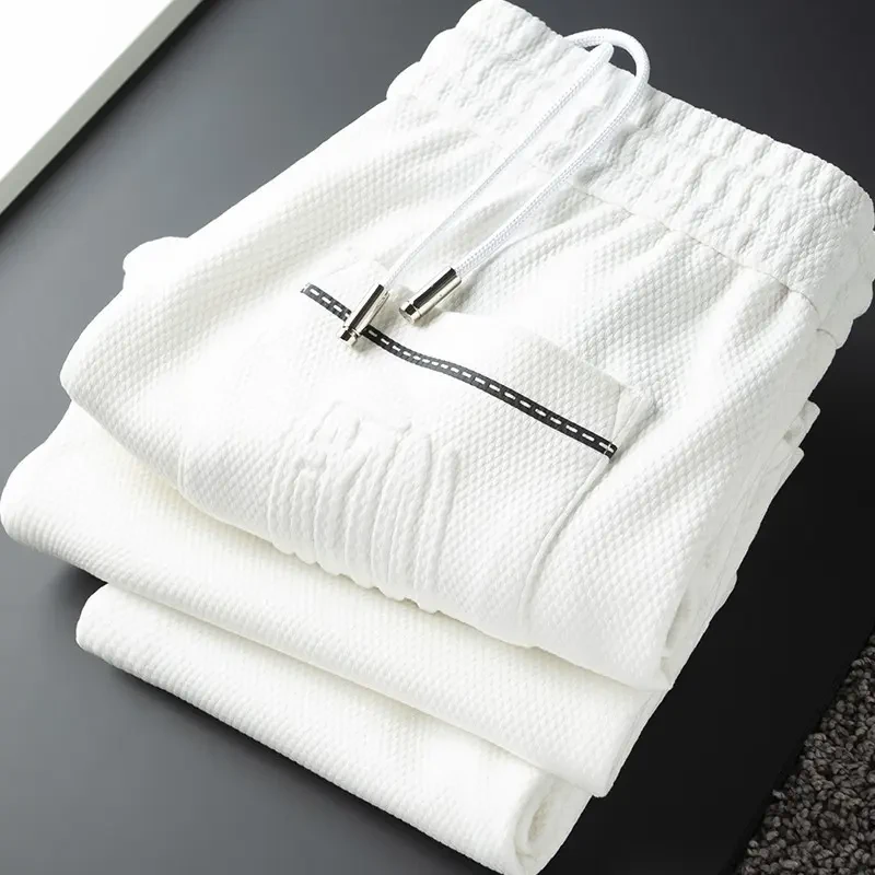 ins潮流春夏秋季痞帅修身轻奢运动裤男士百搭休闲九分裤BQ