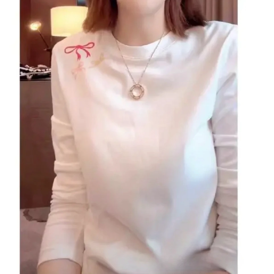 设计感肩上蝴蝶结长袖T恤女秋冬休闲长袖时尚印花圆领白色打底衫