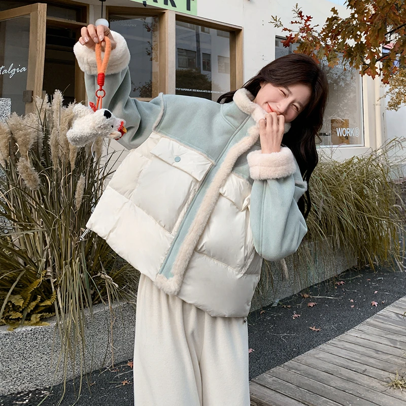 绿色时尚皮毛一体拼接羽绒服女冬2024新款设计感白鸭绒厚实外套