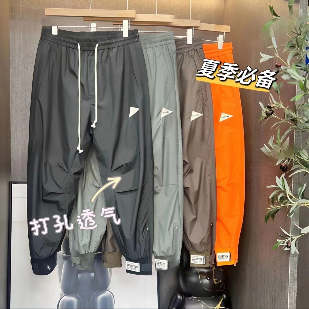 夏季新款男士冰丝潮牌激光打孔透气百搭束脚空调裤宽松哈伦休闲裤