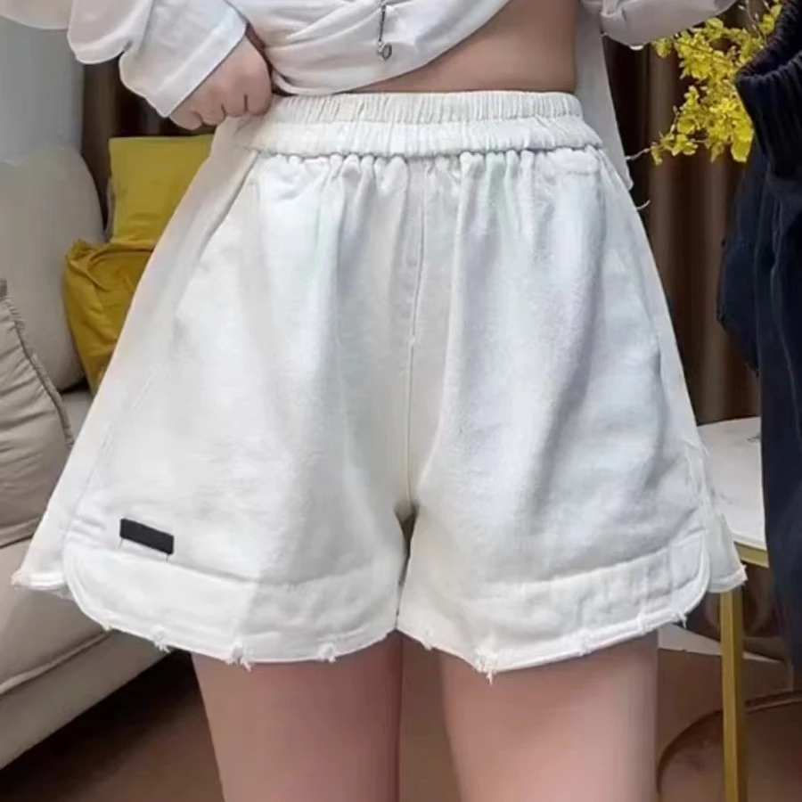 欧洲站2025春夏新款松紧腰休闲裤宽松口袋破边贴标阔腿牛仔短裤潮