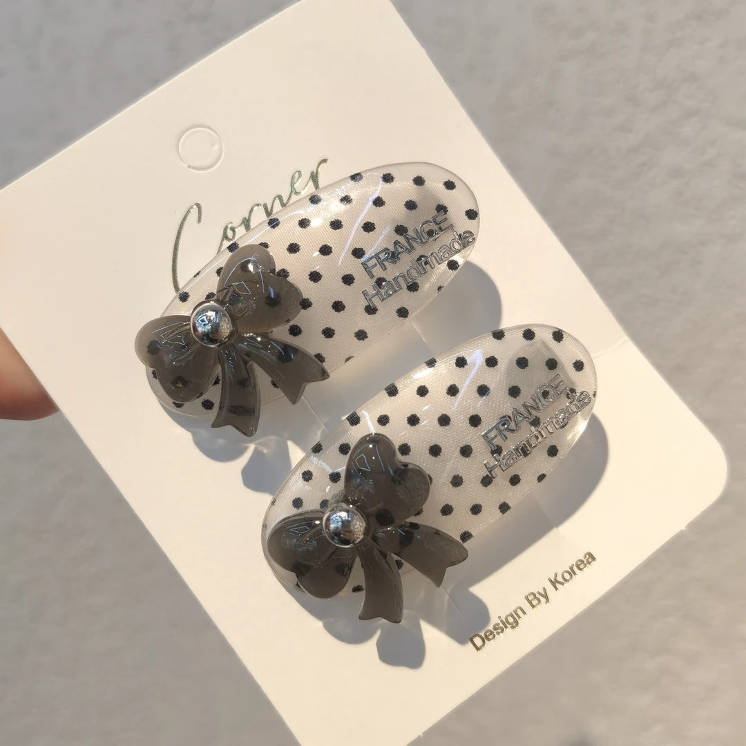 A278白色波点蝴蝶结边夹一对