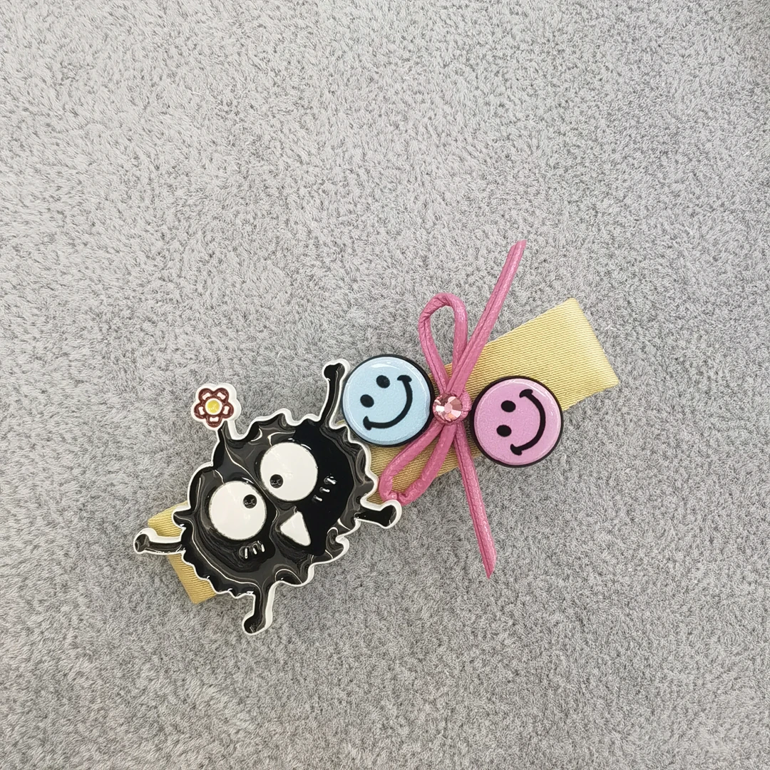A692黑色小煤球笑脸边夹