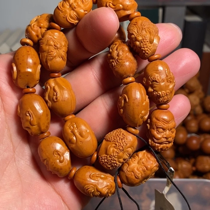 橄榄核核雕红红火火