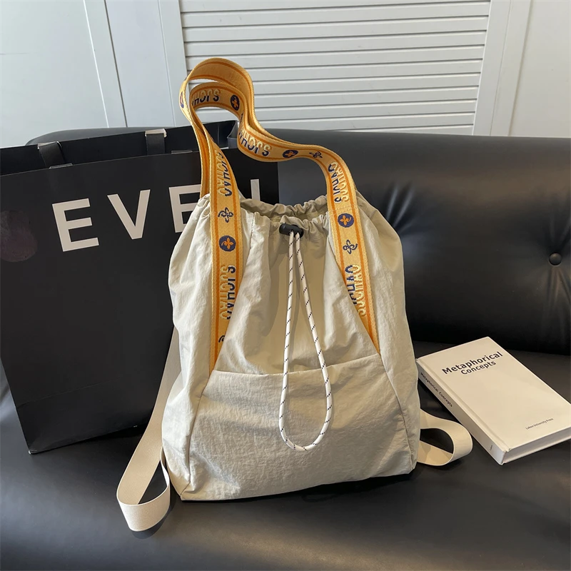 大容量单肩包双肩包时尚休闲旅行包学生电脑包百搭小众抽绳通勤包