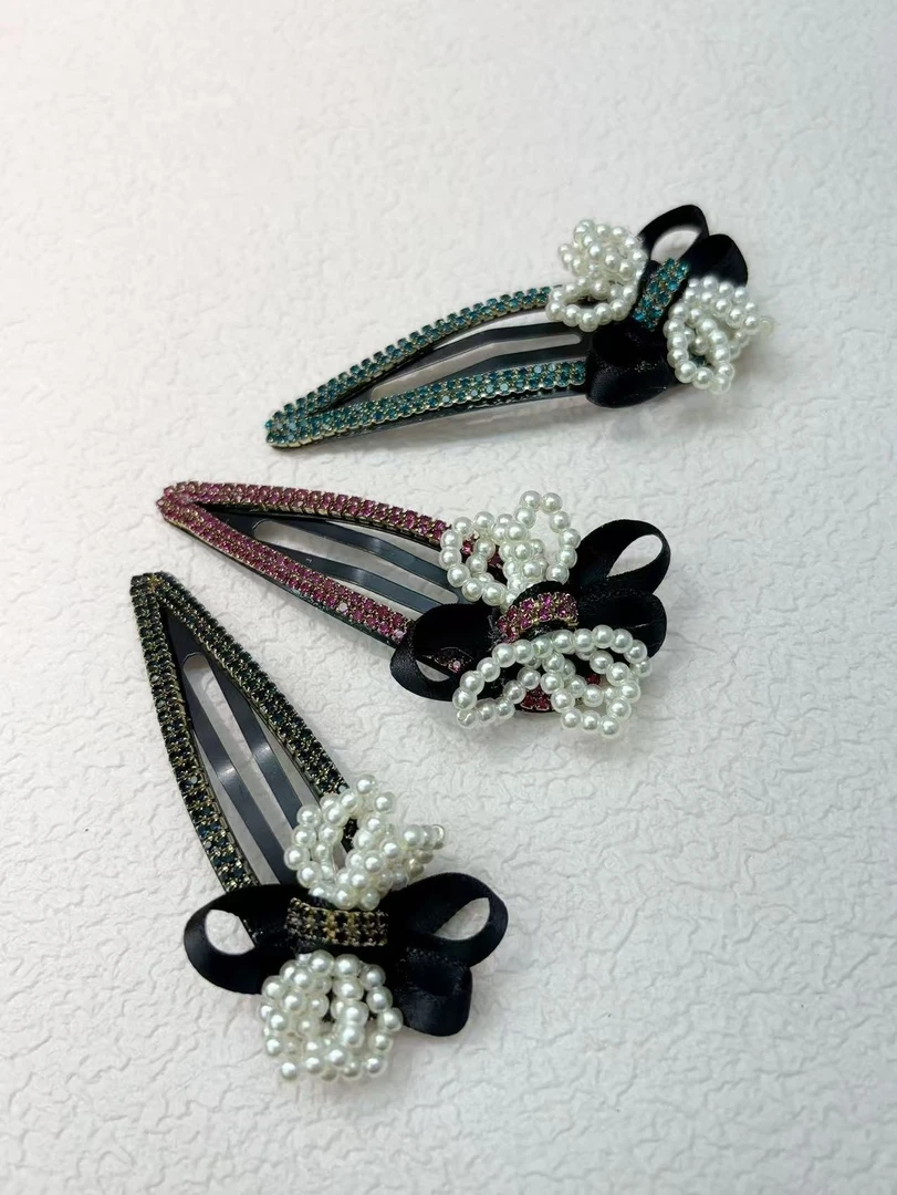 东大门气质时尚球球蝴蝶结镂空发夹边夹A81