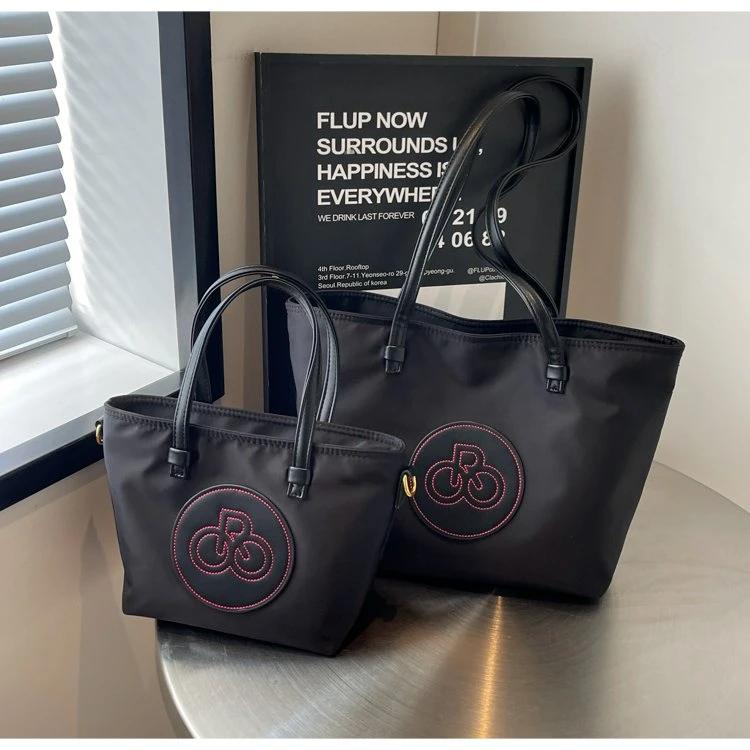 新款大容量尼龙休闲水桶包女百搭通勤托特包斜挎手提包2025时尚款